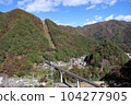 A train running on the Yunishigawa Bridge on the Aizu Kinugawa Line during the fall foliage season 104277905