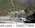 A train running on the Yunishigawa Bridge on the Aizu Kinugawa Line during the fall foliage season 104277906