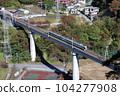 A train running on the Yunishigawa Bridge on the Aizu Kinugawa Line during the fall foliage season 104277908
