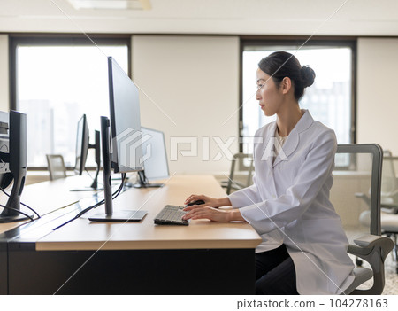 Woman doing research Woman doing research 104278163