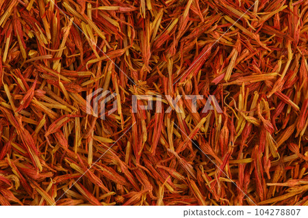 Stamen spicy pinch of Saffron close up. Fragrant spice saffron background. Texture of red and orange saffron. Stigmas of crocus flower. Stamen spicy pinch of Saffron close up. Fragrant spice saffron background. Texture of red and orange saffron. Stigmas of crocus flower. 104278807