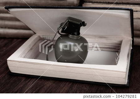 hand grenade hidden in a book 104279281