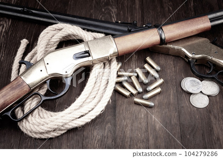 Old west guns. Lever action repeating rifles with ammunition 104279286