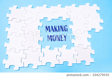 white puzzles on a blue background with the text MAKING MONEY white puzzles on a blue background with the text MAKING MONEY 104279545