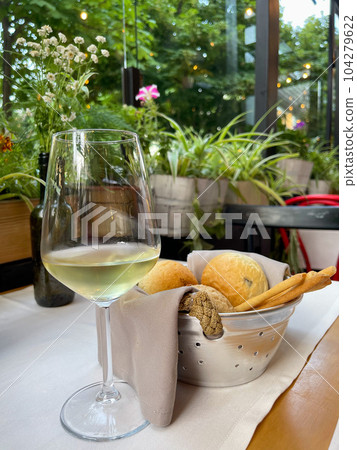Basket with different types of fresh breads on the table. Basket with different types of fresh breads on the table. 104279622