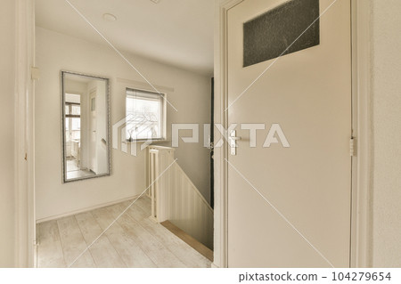 an empty room with white walls and wood flooring on the left side of the room, there is a chalk board that says 104279654