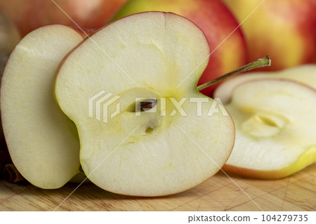 Sliced apple on a chopping board, close up Sliced apple on a chopping board, close up 104279735
