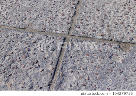 old concrete decorative road made of concrete and rubble 104279736