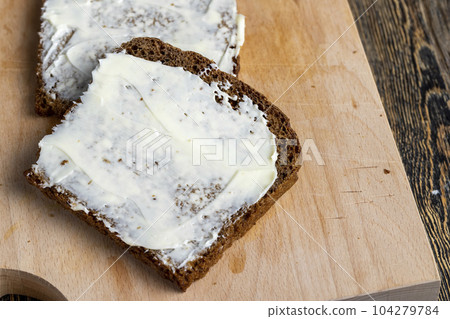 Black rye bread with butter Black rye bread with butter 104279784