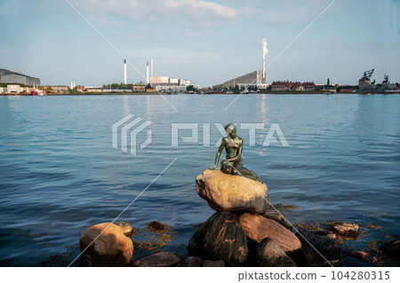 Famous Mermaid statue in Copenhagen - old statue of 1913 year. Famous Mermaid statue in Copenhagen - old statue of 1913 year. 104280315