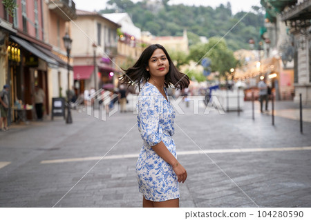 Beautiful young mixed race woman in the old town of Nice, France 104280590
