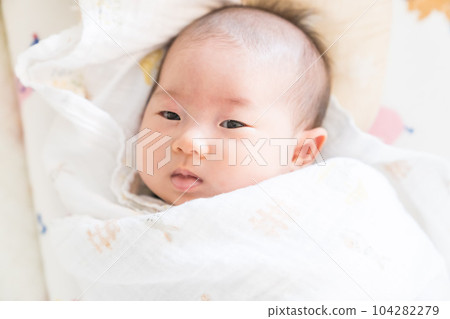 A swaddled baby A swaddled baby 104282279