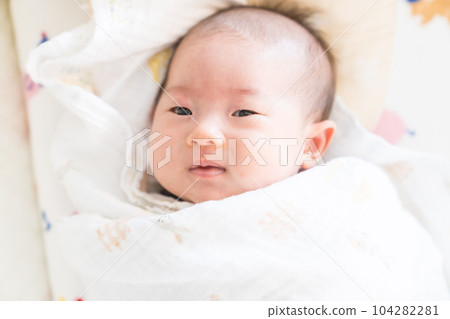 A swaddled baby A swaddled baby 104282281