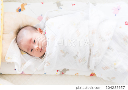 A swaddled baby A swaddled baby 104282657