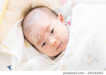 A swaddled baby A swaddled baby 104282661
