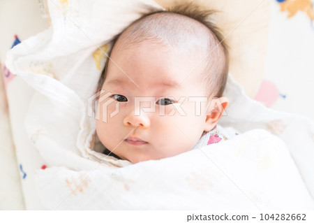 A swaddled baby A swaddled baby 104282662