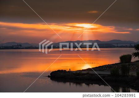 Morning sun over the lake 104283991