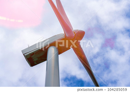 Close up of Wind turbine generating electricity clean energy with cloud background on the sky. Clean energy concept. 104285059