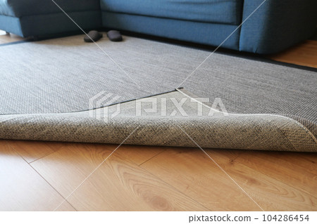 Seamless grey carpet texture background on wooden floor with copy space Seamless grey carpet texture background on wooden floor with copy space 104286454