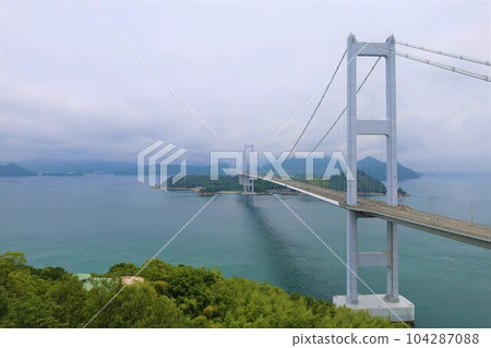 From Osakikamijima in Hiroshima to Omishima by ferry and then to Umashima in Imabari via the Shimanami Kaido between the rainy season and early summer 104287088