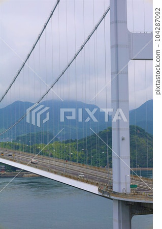 From Osakikamijima in Hiroshima to Omishima by ferry and then to Umashima in Imabari via the Shimanami Kaido between the rainy season and early summer 104287092