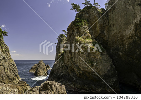 Kitayamazaki with beautiful cliffs and blue sea Kitayamazaki with beautiful cliffs and blue sea 104288316