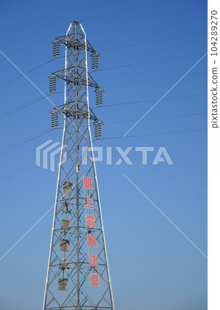 Blue sky and transmission tower 104289270