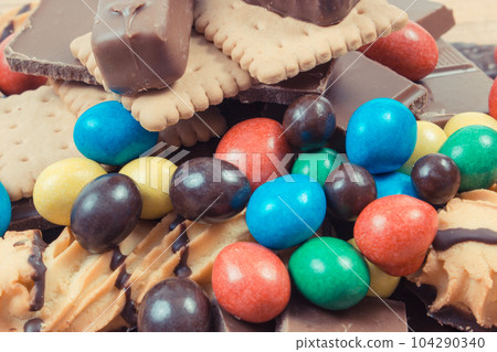 Heap of sweets containing a lot of sugar. Unhealthy eating 104290340