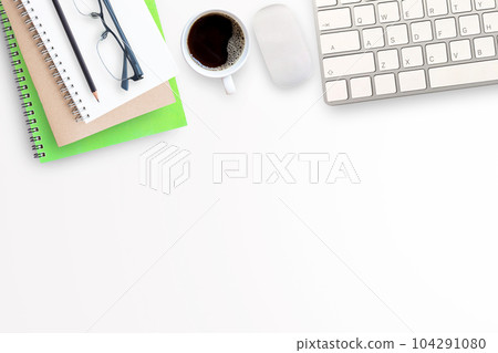Cup of coffee, notebook with office tools and mini mouse and keyboard wireless on white office desk Cup of coffee, notebook with office tools and mini mouse and keyboard wireless on white office desk 104291080
