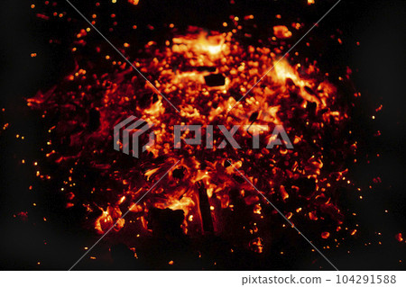 Background of burning coals in a barbecue brazier 104291588