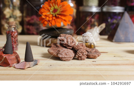 Incense Cones and Desert Rose Rocks on Meditation Table Incense Cones and Desert Rose Rocks on Meditation Table 104291697