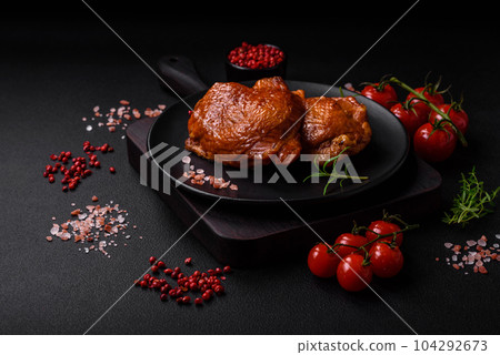 Delicious fried or smoked chicken thighs grilled with spices and herbs Delicious fried or smoked chicken thighs grilled with spices and herbs 104292673