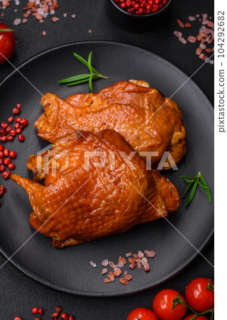 Delicious fried or smoked chicken thighs grilled with spices and herbs 104292682