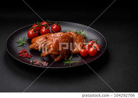 Delicious fried or smoked chicken thighs grilled with spices and herbs 104292706