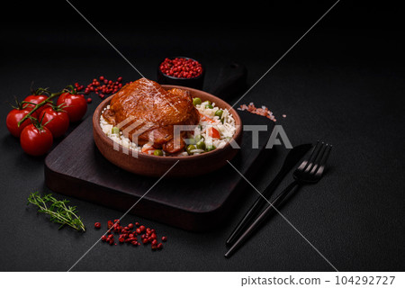 Delicious boiled rice with chicken and vegetables or risotto with salt, spices and herbs Delicious boiled rice with chicken and vegetables or risotto with salt, spices and herbs 104292727