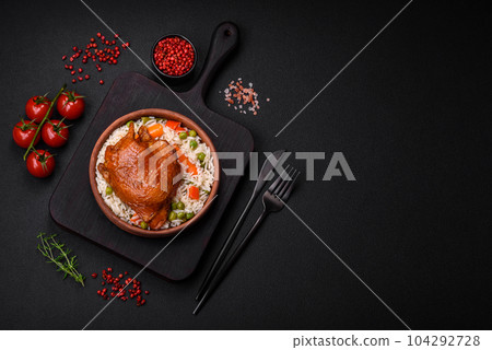 Delicious boiled rice with chicken and vegetables or risotto with salt, spices and herbs Delicious boiled rice with chicken and vegetables or risotto with salt, spices and herbs 104292728