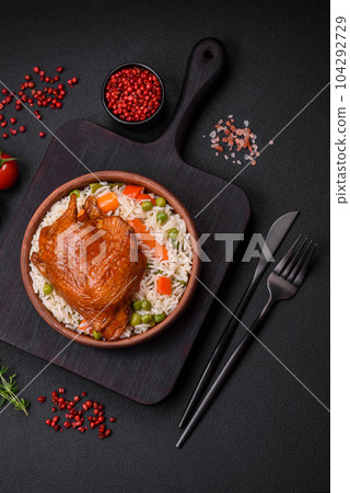 Delicious boiled rice with chicken and vegetables or risotto with salt, spices and herbs 104292729