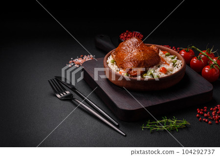 Delicious boiled rice with chicken and vegetables or risotto with salt, spices and herbs Delicious boiled rice with chicken and vegetables or risotto with salt, spices and herbs 104292737