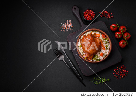 Delicious boiled rice with chicken and vegetables or risotto with salt, spices and herbs Delicious boiled rice with chicken and vegetables or risotto with salt, spices and herbs 104292738