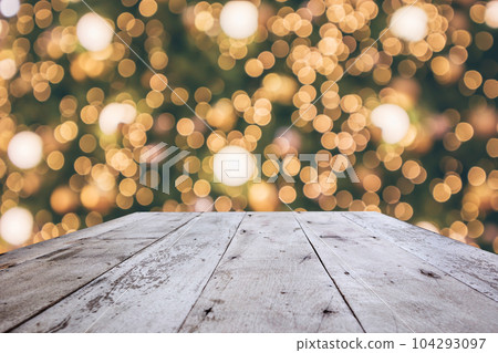 Wood table top with abstract christmas holiday festive bokeh light on tree blurred background for montage product display 104293097