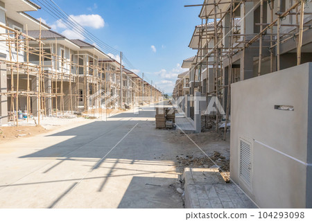 construction residential new house in progress at building site housing estate development construction residential new house in progress at building site housing estate development 104293098