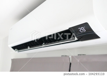 Air conditioner on white wall room interior background Air conditioner on white wall room interior background 104293110