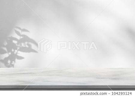 Marble table with tree shadow drop on white wall background for mockup product display 104293124