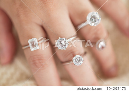 Female hand with beautiful jewelry diamond ring Female hand with beautiful jewelry diamond ring 104293473