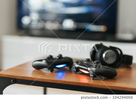 Gamepads on the table 104294008