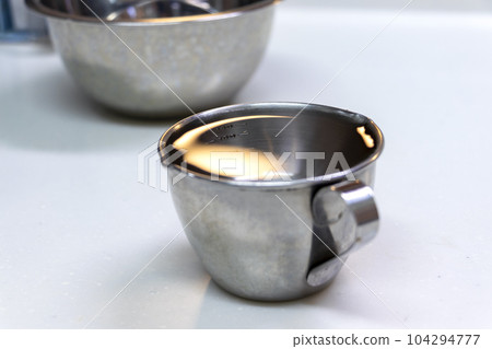 water in measuring cup water in measuring cup 104294777