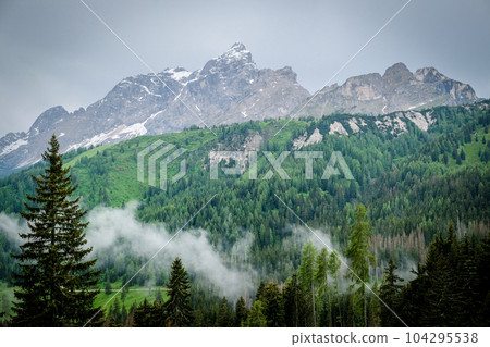 Dolomite mountains in Italy in summer. Tourism in the Dolomites. Dolomite mountains in Italy in summer. Tourism in the Dolomites. 104295538