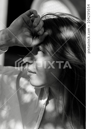 Beautiful girl black and white portrait, sunlight face portrait, summer time picture with blurry bokeh background, romantic mood, fashion beauty female model photo, black and white, monochrome Beautiful girl black and white portrait, sunlight face portrait, summer time picture with blurry bokeh background, romantic mood, fashion beauty female model photo, black and white, monochrome 104295654
