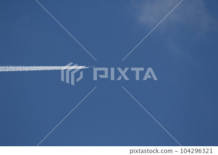 A plane and vapor trails in the sky A plane and vapor trails in the sky 104296321