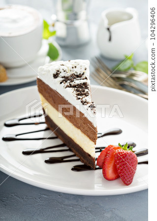 Three chocolate layered mousse cake 104296406